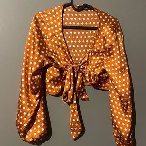 Burnt orange satin polka dot tie front blouse